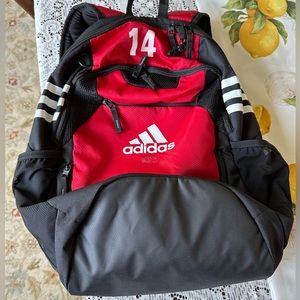 Red Adidas stadium backpack numbered 14